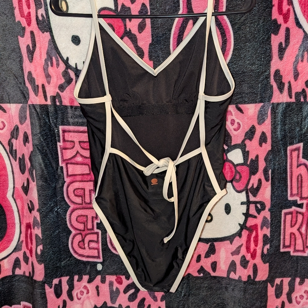 Black and White One-Piece Swimsuit with V-Neck and High-Cut Legs